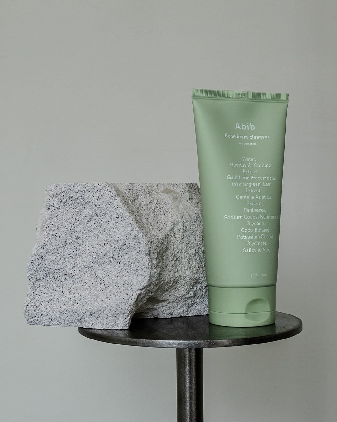 Abib Acne Foam Cleanser on table with stone 