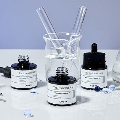 COSRX The Hyaluronic Acid 3 Serum bottles with others in background